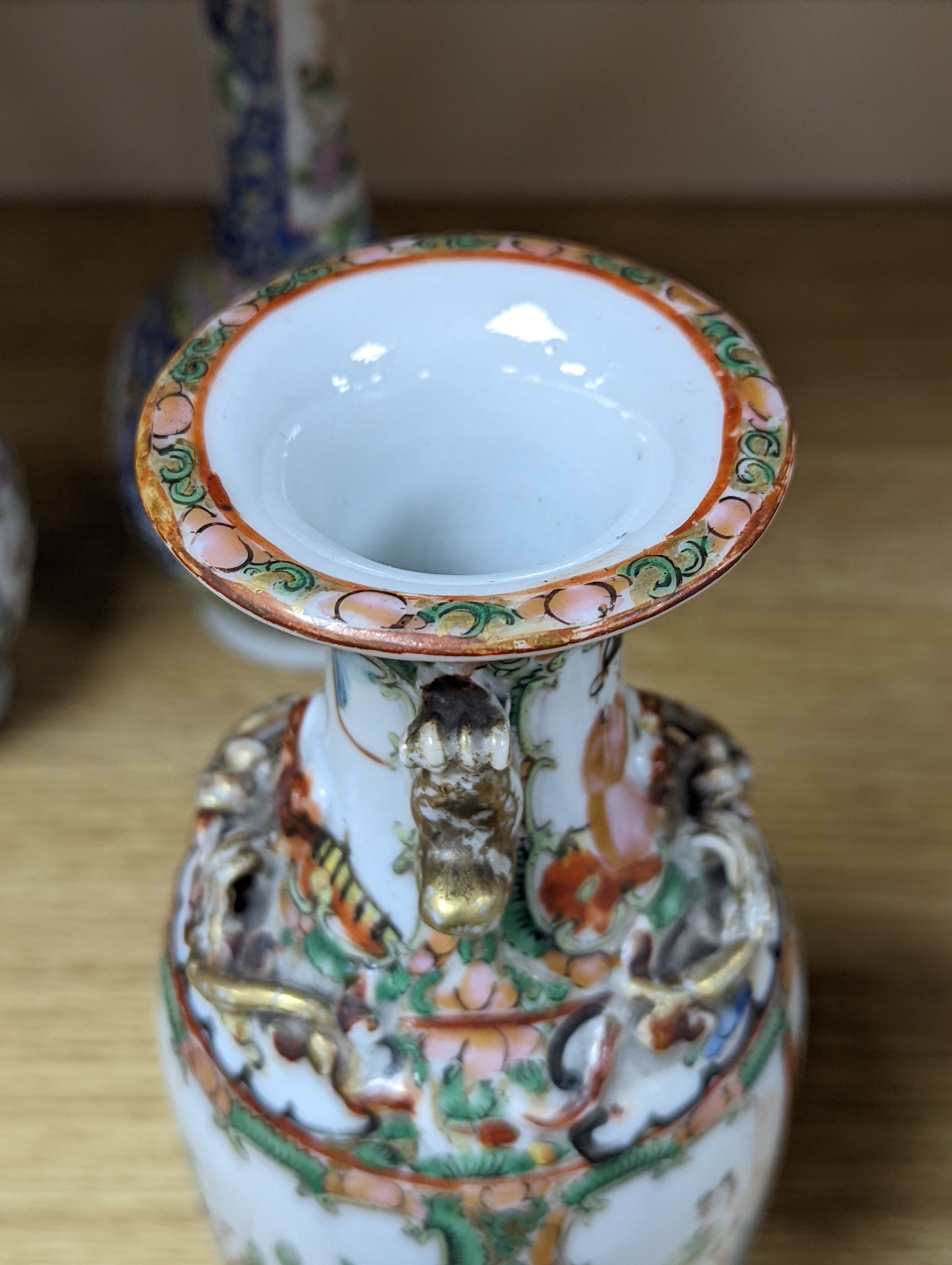Four 19th century Chinese famille rose vases, 21cm